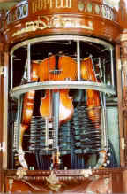 Close-up view of the three violins in the Hupfeld Model B Phonoliszt-Violina.